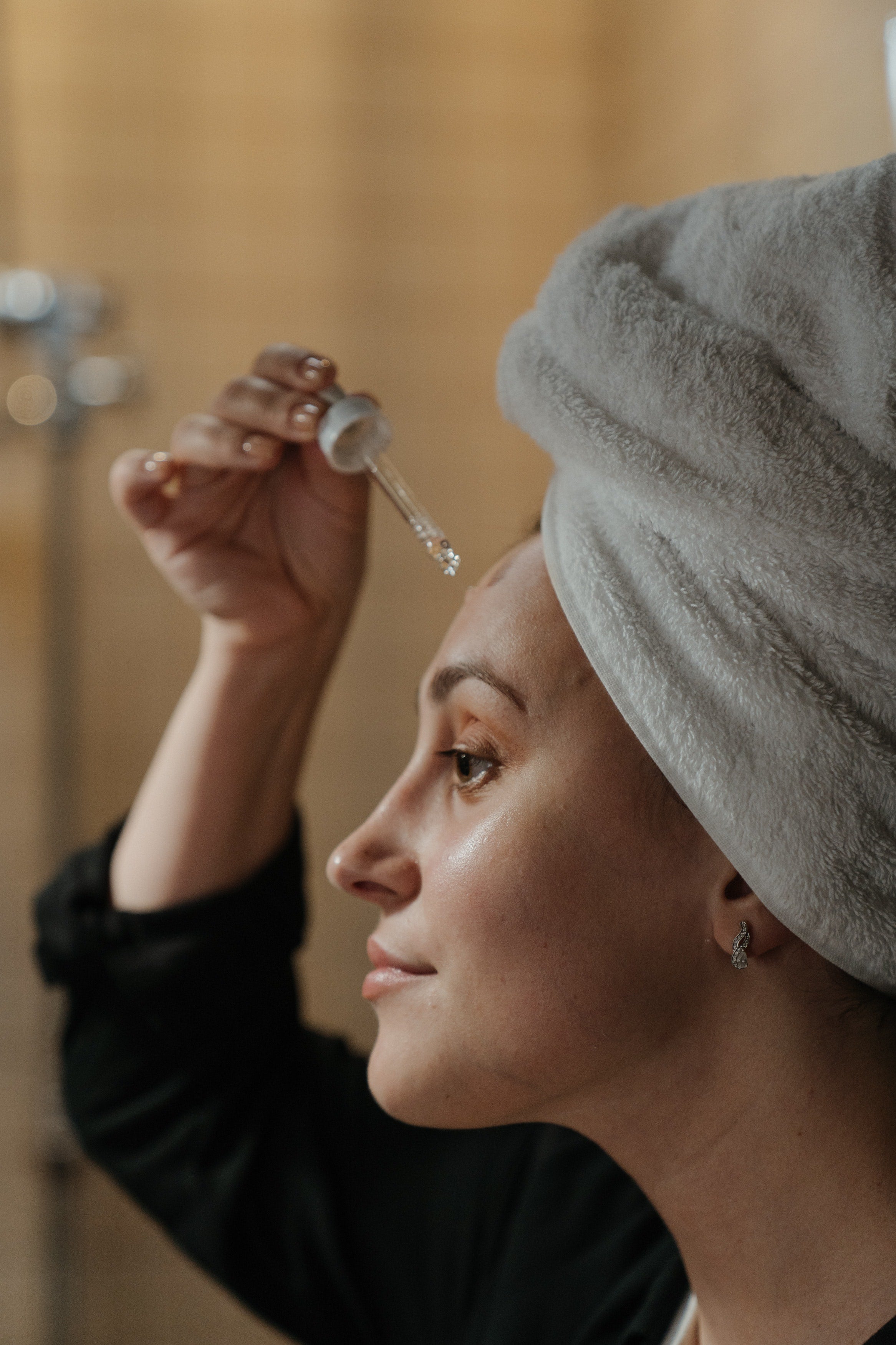 prebiotic skincare serum being applied to the skin on the face
